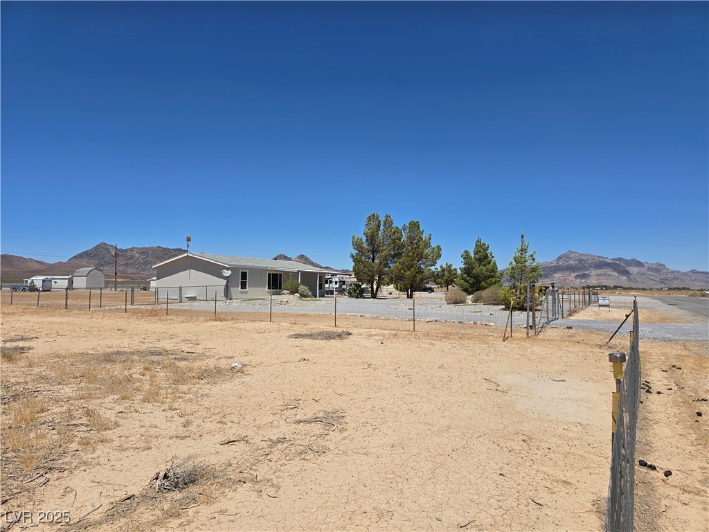 330 Gilmore Road Pahrump, NV 89060 - Photo 42 of 42 Fenced vacant fence lot next door. to south of hom