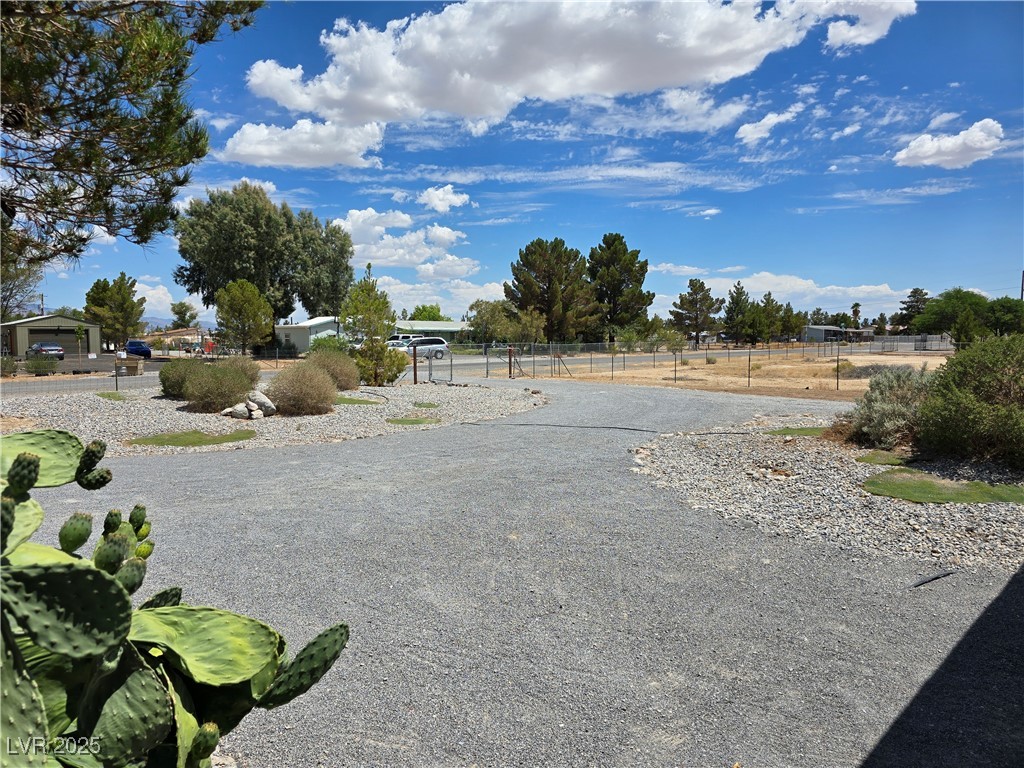 330 Gilmore Road Pahrump, NV 89060 - Photo 10 of 42 Front yard and circle drive with two gates.