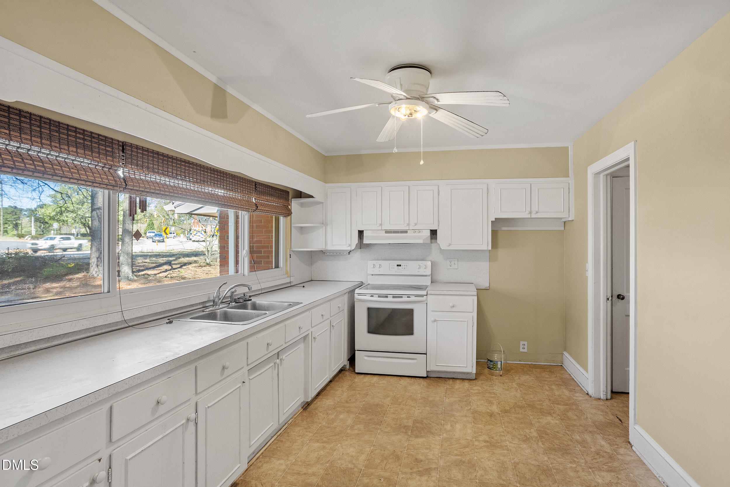 5011 Old Stage Road Raleigh, NC 27603 - Photo 16 of 29 a kitchen with a stove oven and sink