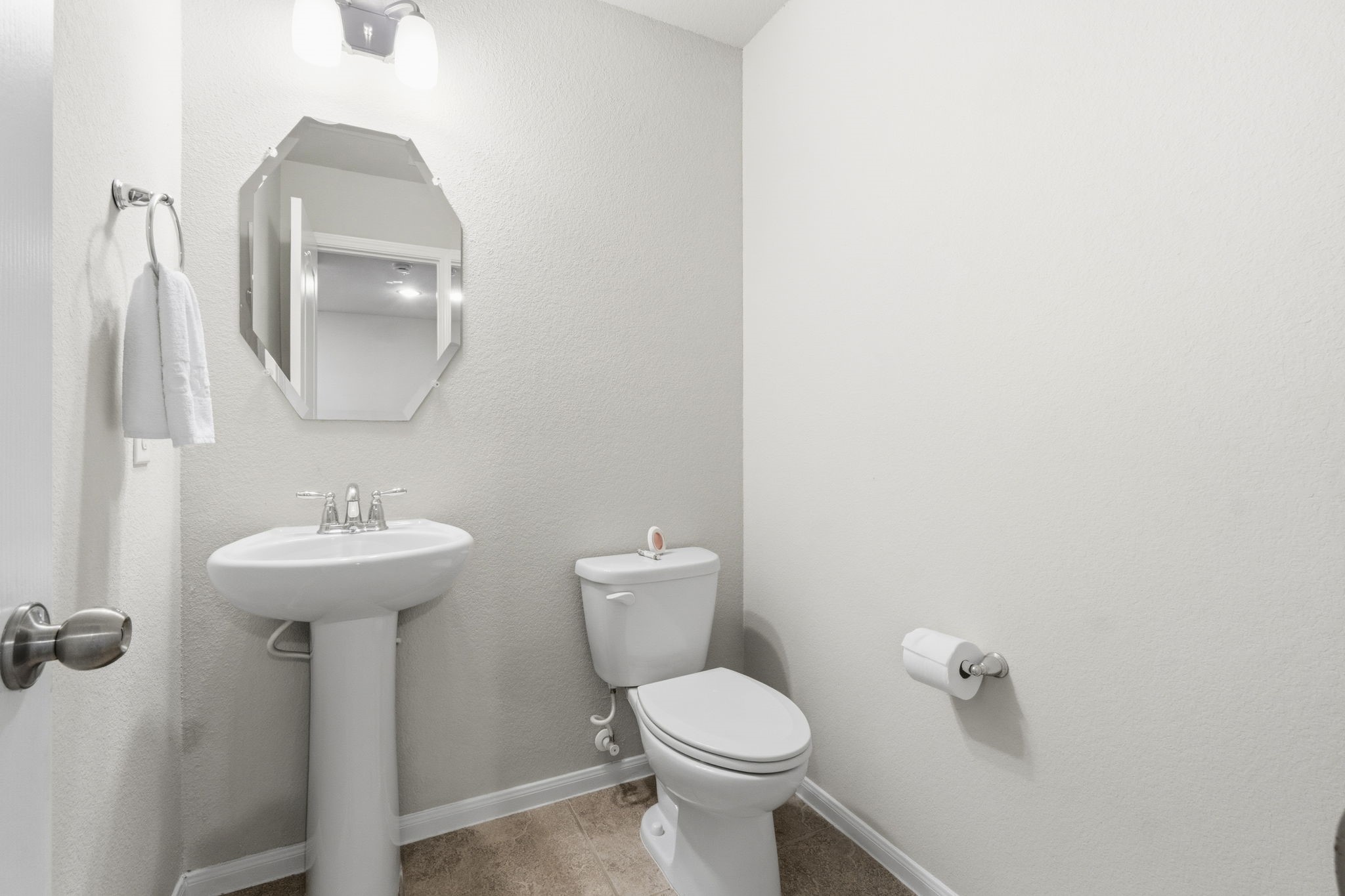 3900 Enchanted Timbers Lane Spring, TX 77386 - Photo 34 of 49 a bathroom with a toilet a sink and mirror