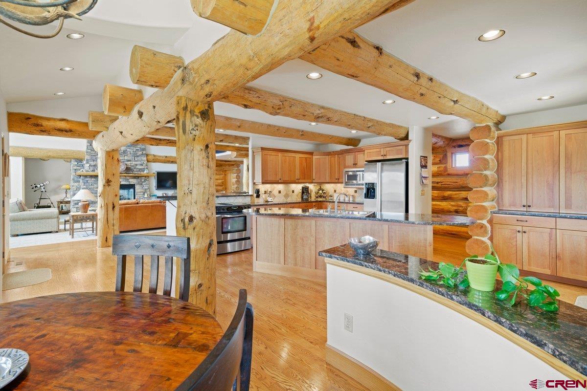 800 Pine Drive Ridgway, CO 81432 - Photo 14 of 35 a large kitchen with lots of counter space and windows