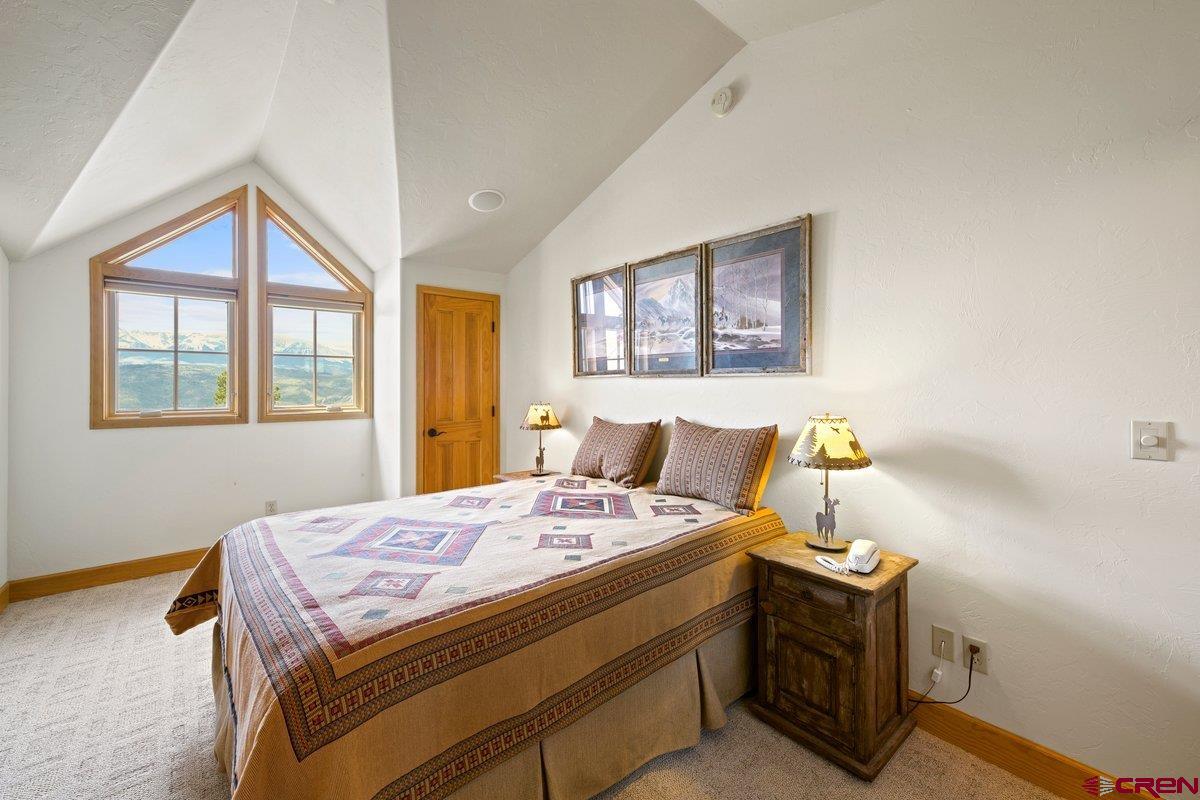 800 Pine Drive Ridgway, CO 81432 - Photo 22 of 35 a bedroom with a bed and a window