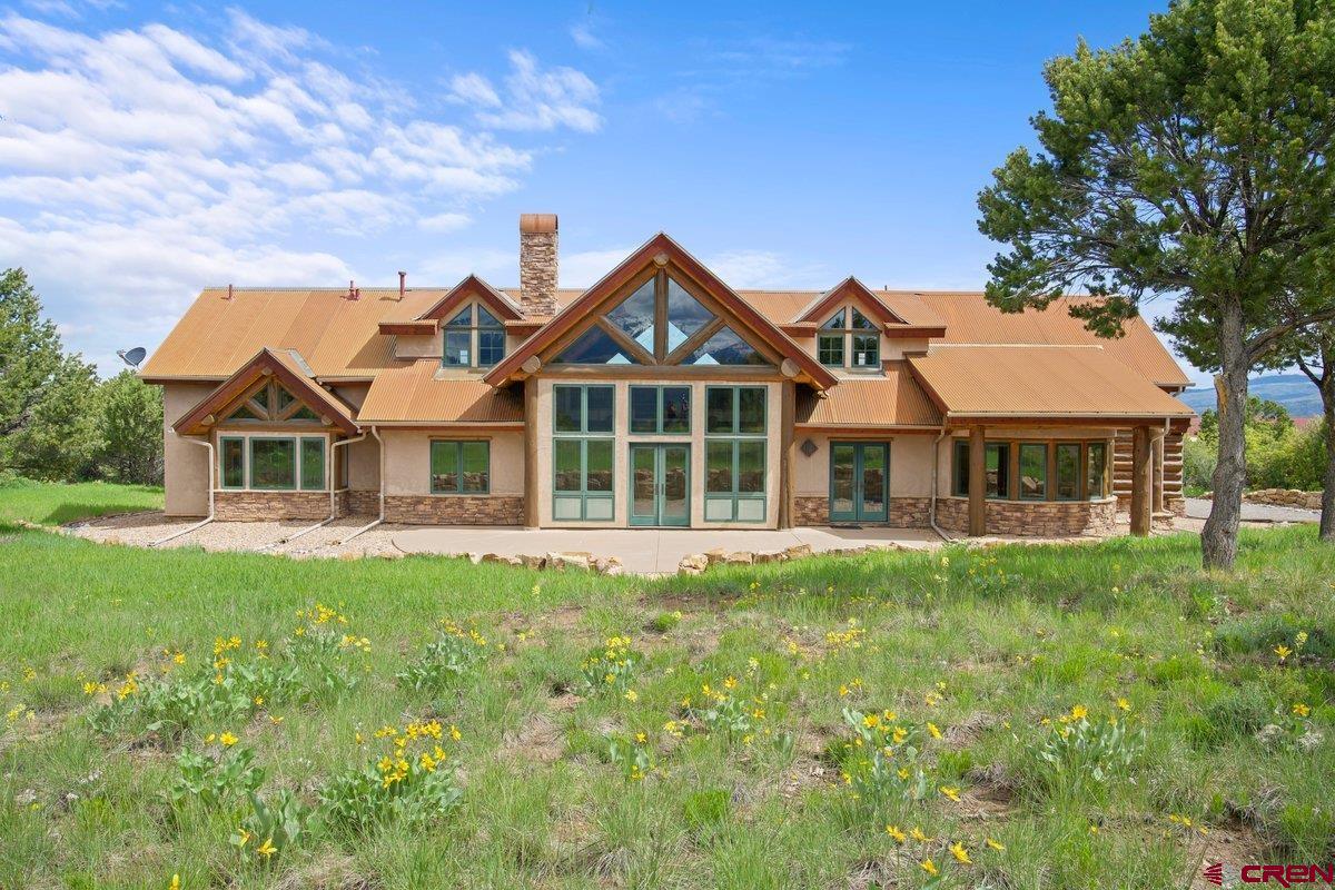 800 Pine Drive Ridgway, CO 81432 - Photo 28 of 35 a front view of a house with a garden