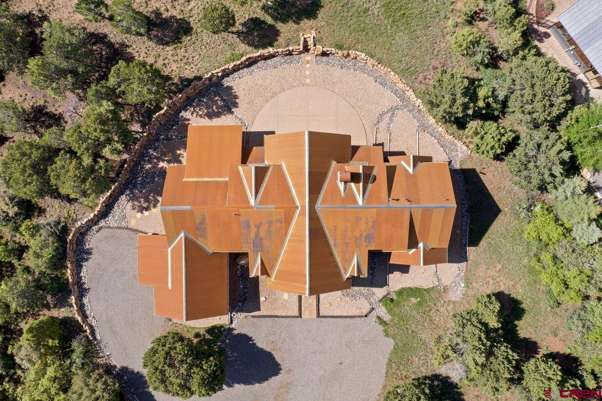 800 Pine Drive Ridgway, CO 81432 - Photo 34 of 35 an aerial view of a house with swimming pool and large trees