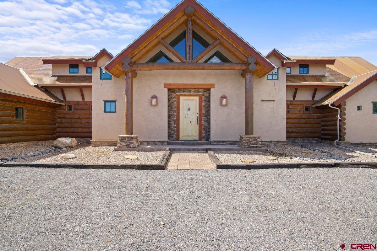 800 Pine Drive Ridgway, CO 81432 - Photo 4 of 35 a front view of a house with a yard
