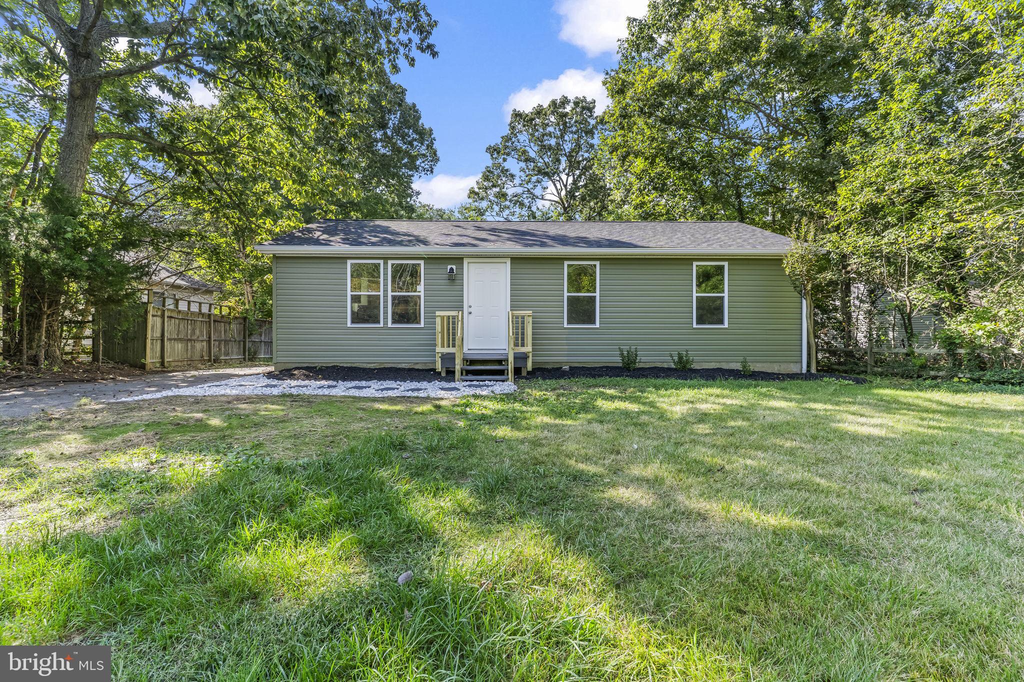 425 Rodeo Road Lusby, MD 20657 - Photo 3 of 33 front view of house with a yard