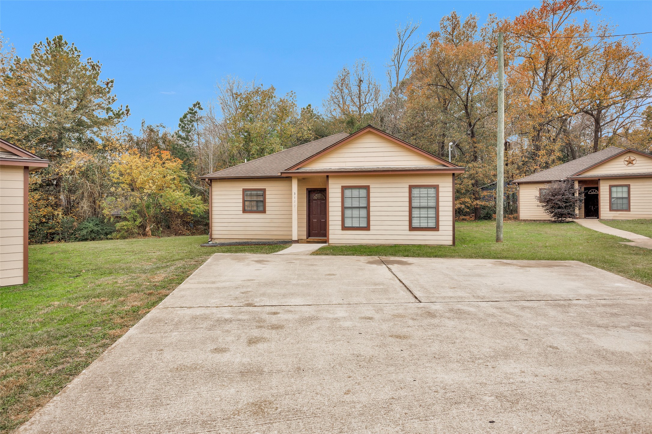 3129 Molly Huntsville, TX 77340 - Photo 1 of 31 front view of a house with a yard