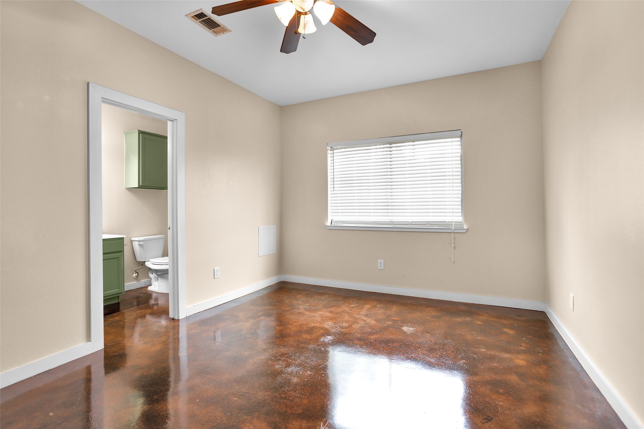 3129 Molly Huntsville, TX 77340 - Photo 16 of 31 an empty room with wooden floor chandelier fan and windows