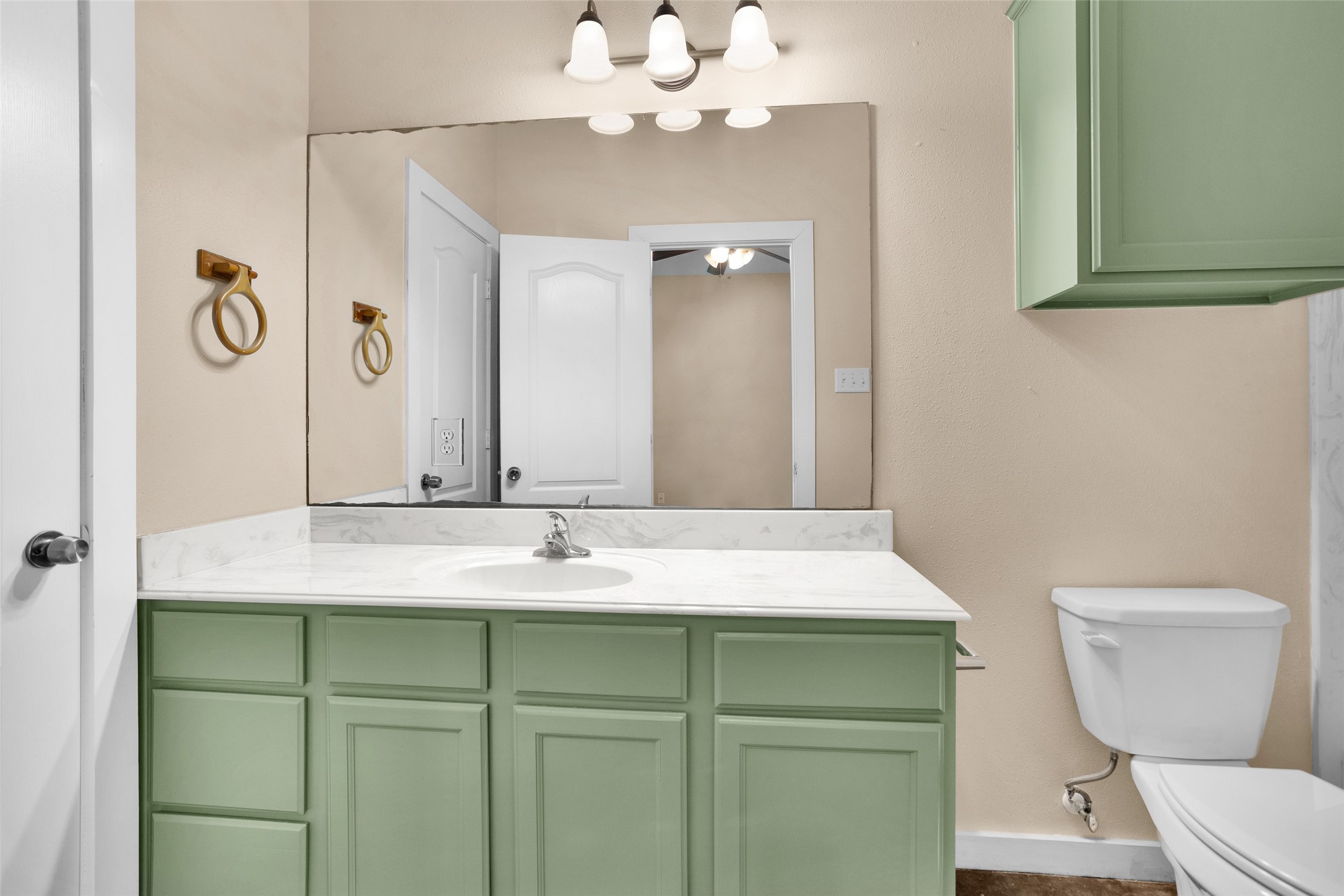 3129 Molly Huntsville, TX 77340 - Photo 18 of 31 a bathroom with a sink vanity mirror and toilet