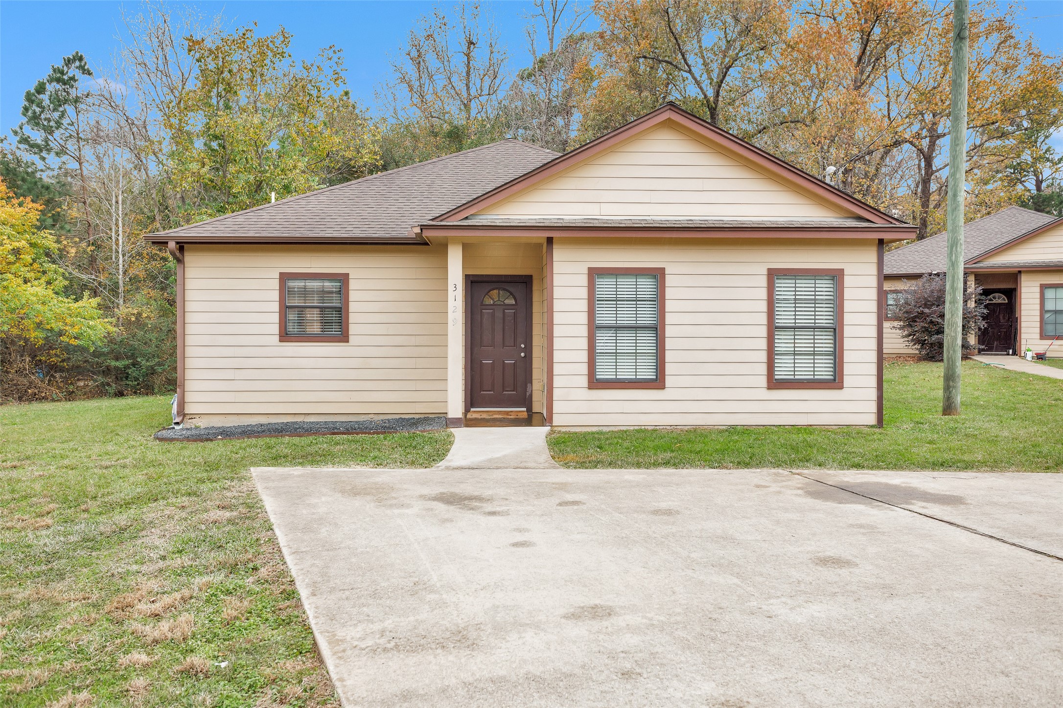 3129 Molly Huntsville, TX 77340 - Photo 2 of 31 a front view of a house with a yard
