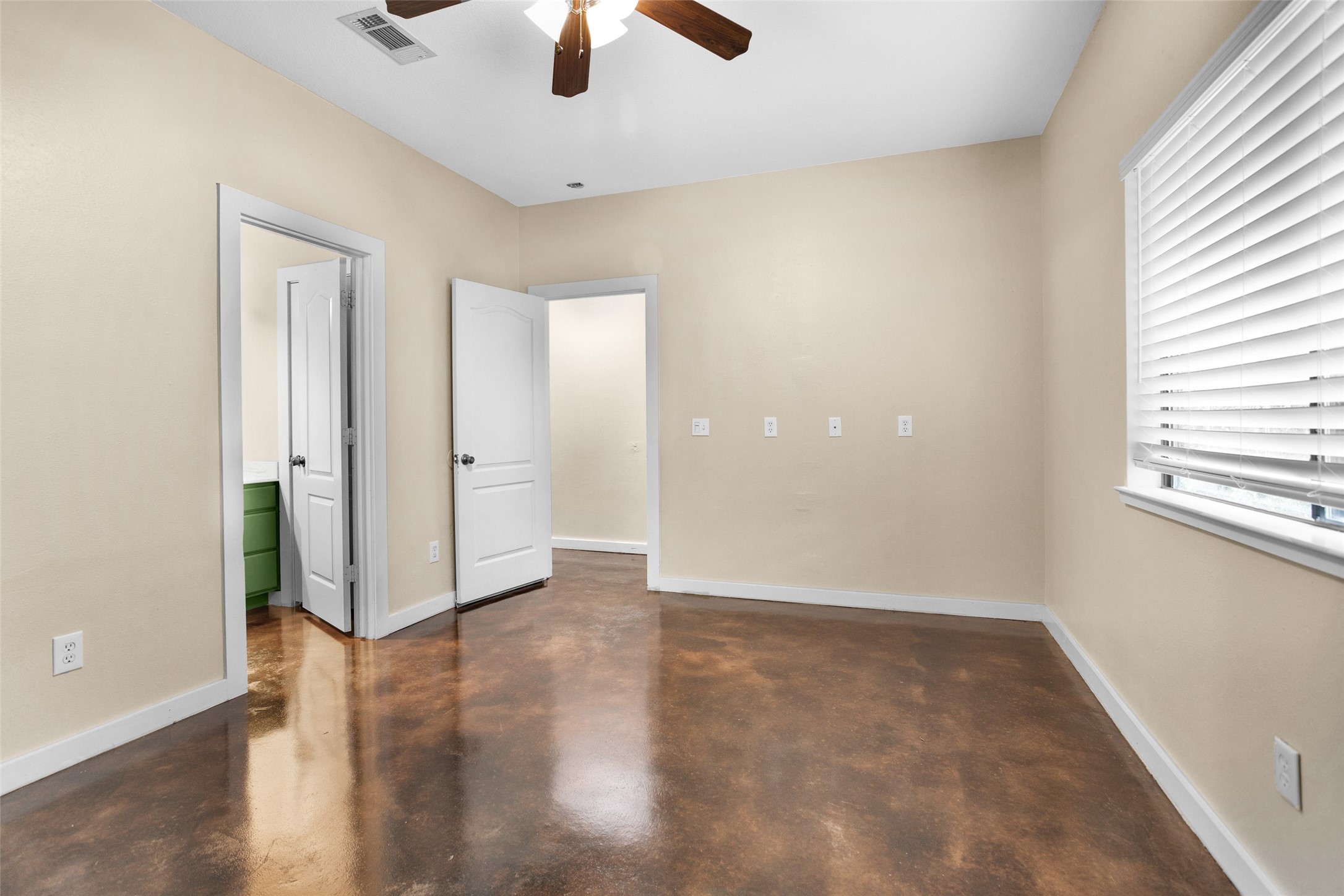 3129 Molly Huntsville, TX 77340 - Photo 26 of 31 an empty room with chandelier fan and windows