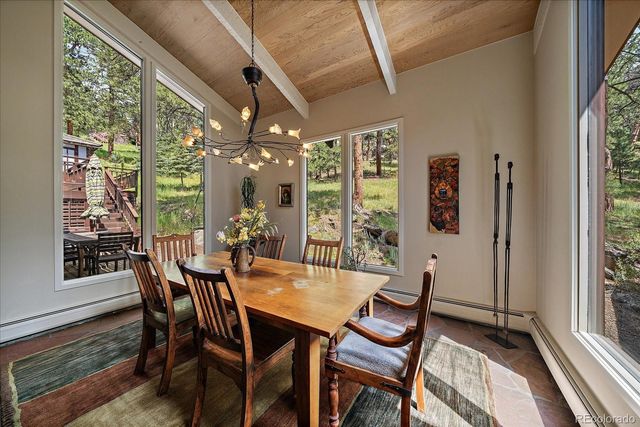 a dining room with furniture and window