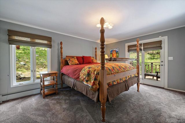 a bed sitting in a room next to a window