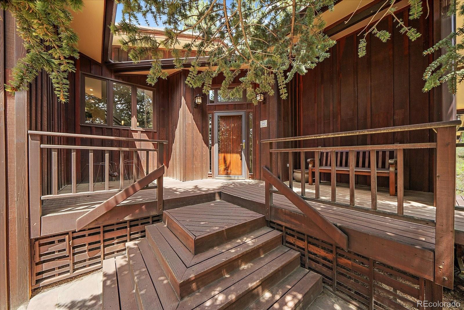 3251 Interlocken Drive Evergreen, CO 80439 - Photo 2 of 43 a view of a house with a deck