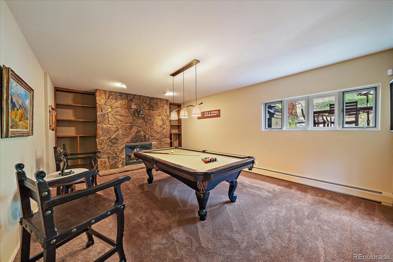 3251 Interlocken Drive Evergreen, CO 80439 - Photo 24 of 43 a room with furniture pool table and windows