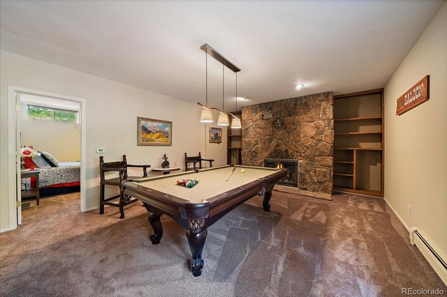 a living room with furniture a table and a flat screen tv