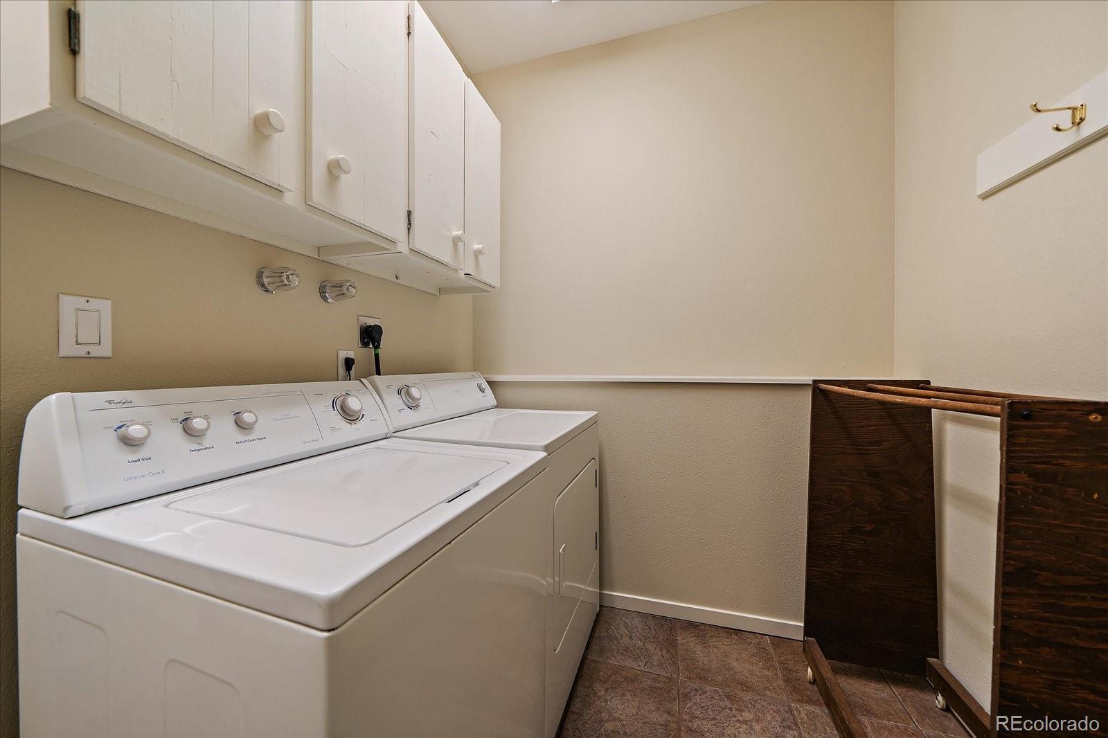 3251 Interlocken Drive Evergreen, CO 80439 - Photo 29 of 43 a utility room with dryer and washer