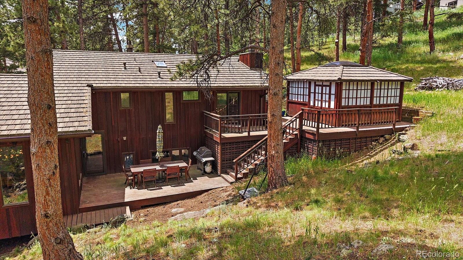 3251 Interlocken Drive Evergreen, CO 80439 - Photo 36 of 43 an aerial view of a house with swimming pool