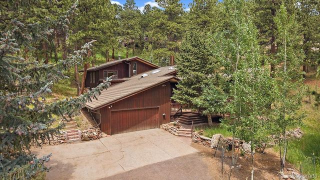 a house with trees in front of it