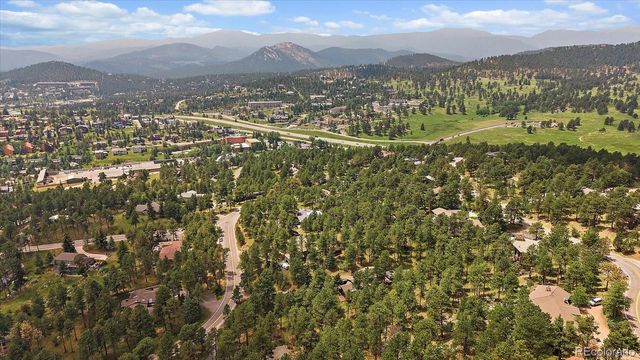 a view of a town with mountains in the background