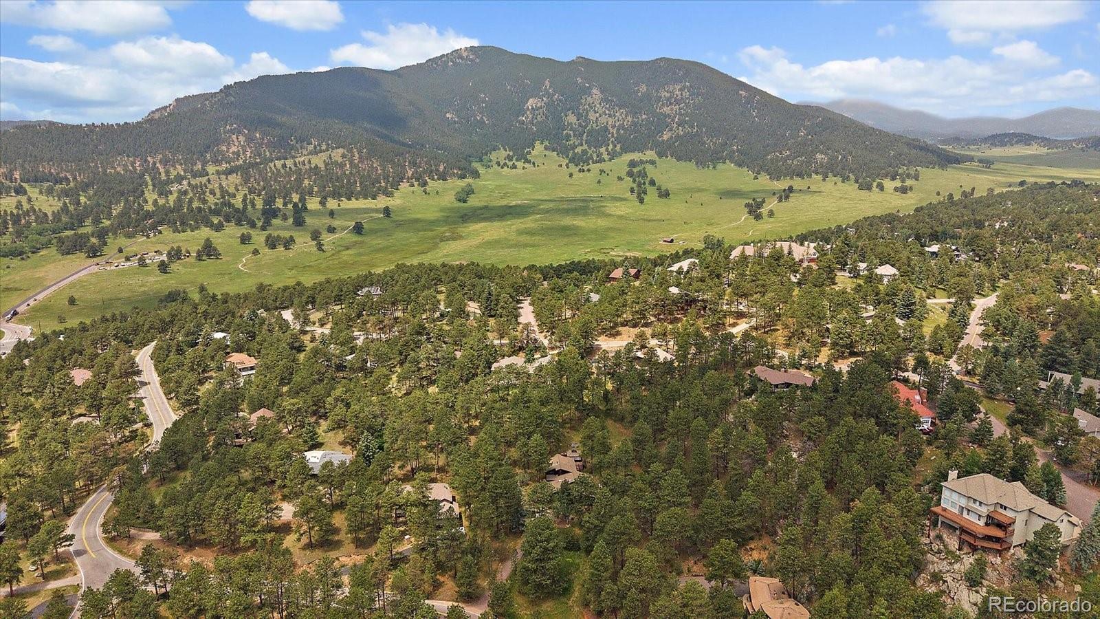 3251 Interlocken Drive Evergreen, CO 80439 - Photo 40 of 43 a view of a mountain with an outdoor space