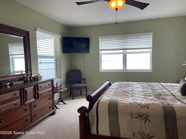 a view of a sink a mirror a vanity and a shower