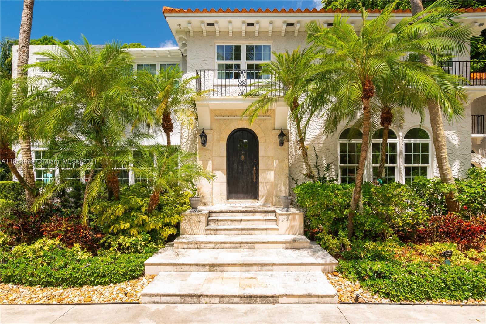 4288 Douglas Road Coconut Grove, FL 33133 - Photo 4 of 69 a front view of a house with a garden
