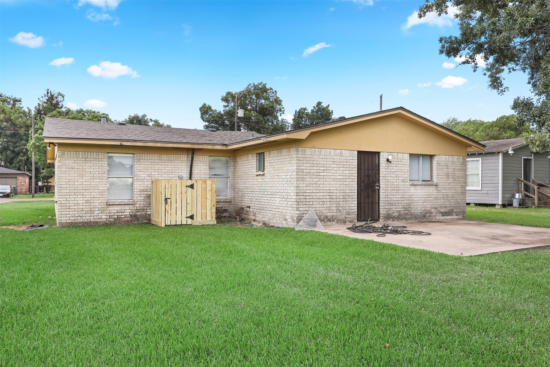 1820 Rosalee Street La Marque, TX 77568 - Photo 5 of 6 a front view of a house with a yard and garage