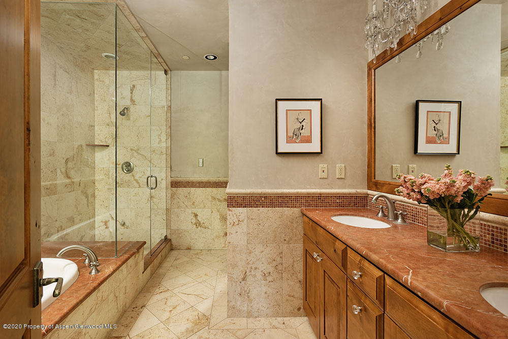 32 Prospector Road Aspen, CO 81611 - Photo 13 of 19 a bathroom with a tub sink and mirror