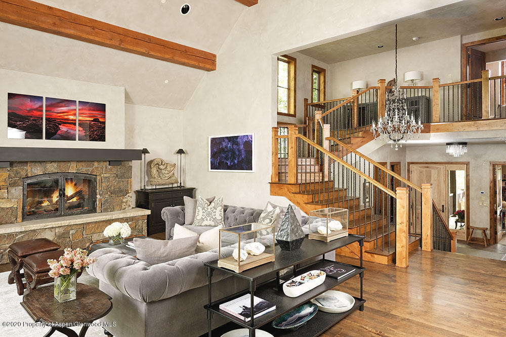 32 Prospector Road Aspen, CO 81611 - Photo 2 of 19 a living room with furniture and a fireplace