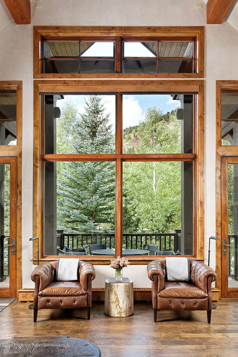 32 Prospector Road Aspen, CO 81611 - Photo 4 of 19 a living room with furniture and floor to ceiling windows