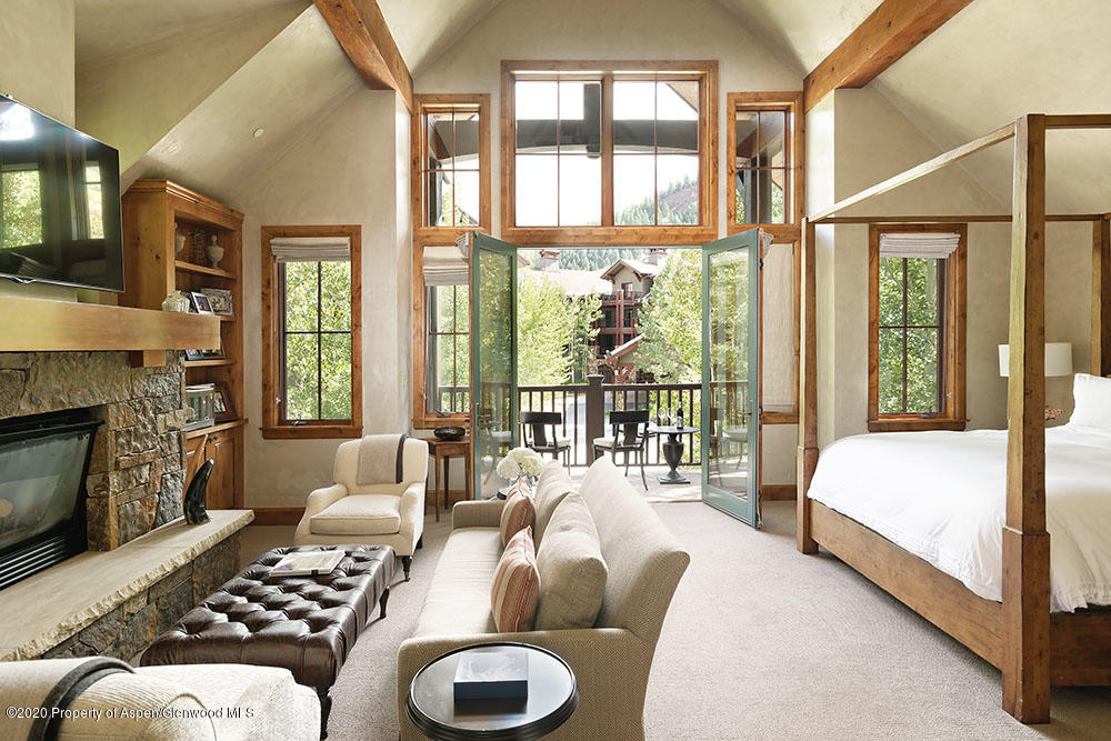 32 Prospector Road Aspen, CO 81611 - Photo 7 of 19 a bedroom with furniture and a large window