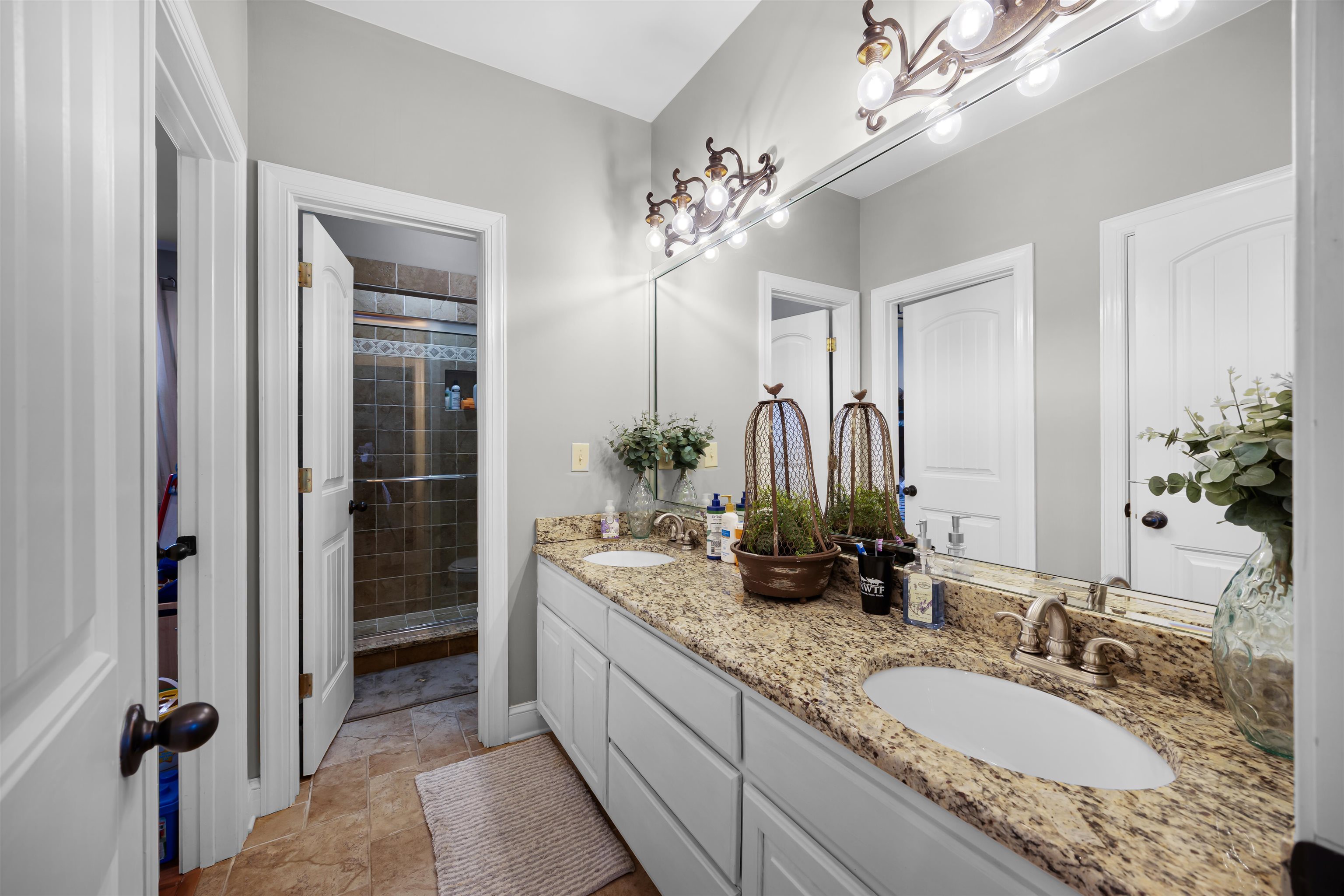 140 Legends Drive Counce, TN 38326 - Photo 21 of 30 Bathroom with double vanity and a shower stall