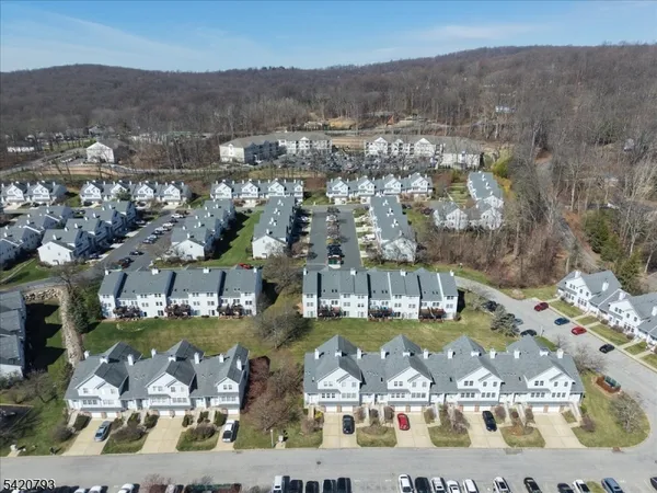 an aerial view of a house with a ocean view