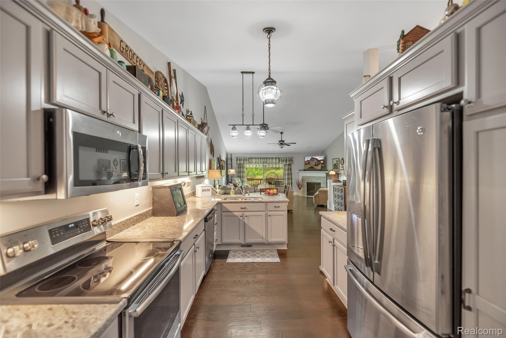 103 Sedum Road Howell, MI 48843 - Photo 8 of 30 Beautiful Wood Floors and Stainless Appliances