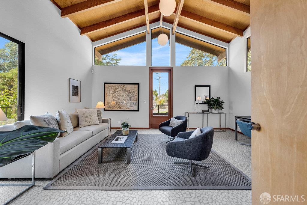 520 Coventry Road Kensington, CA 94707 - Photo 29 of 91 a living room with furniture a rug and a large window