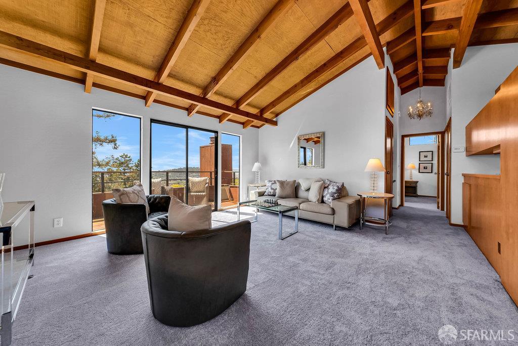 520 Coventry Road Kensington, CA 94707 - Photo 46 of 91 a living room with furniture and a floor to ceiling window