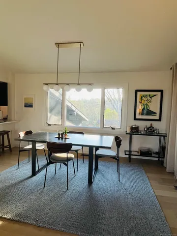 a living room with furniture a window and a table