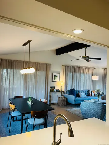 a lobby with furniture and chandelier
