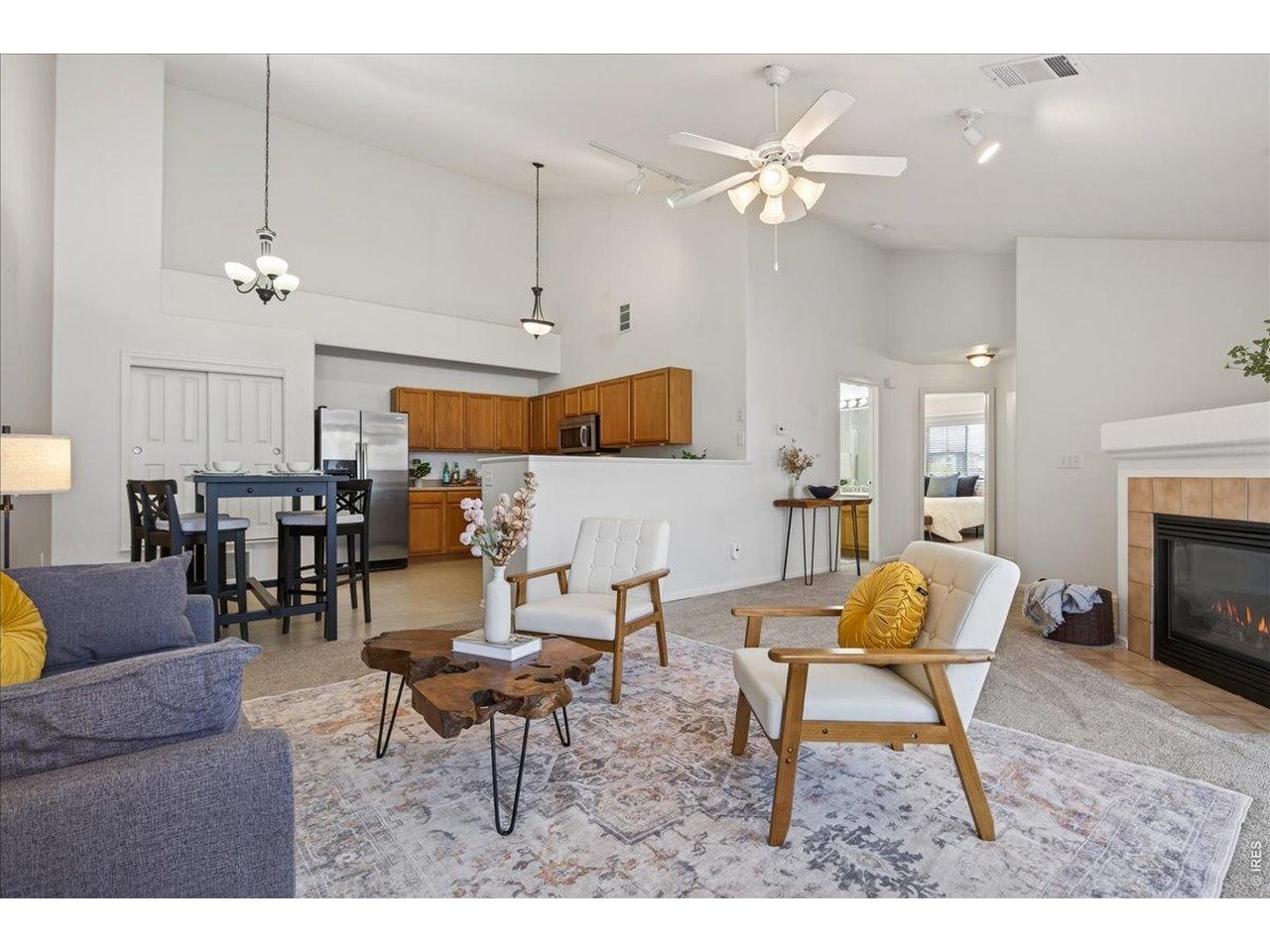 10381 Cook Way, Unit 202 Thornton, CO 80229 - Photo 11 of 38 The open-concept layout seamlessly connects the living room, dining area, and kitchen, creating a functional and welcoming flow throughout the home.