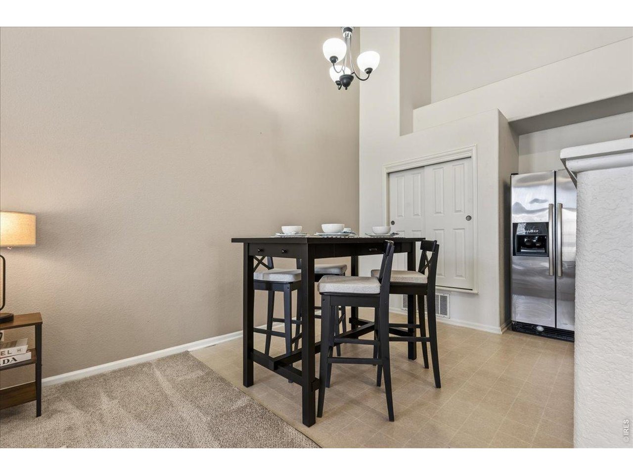 10381 Cook Way, Unit 202 Thornton, CO 80229 - Photo 12 of 38 The dining area offers a comfortable space for everyday meals or entertaining guests while blending seamlessly into the kitchen and living room.