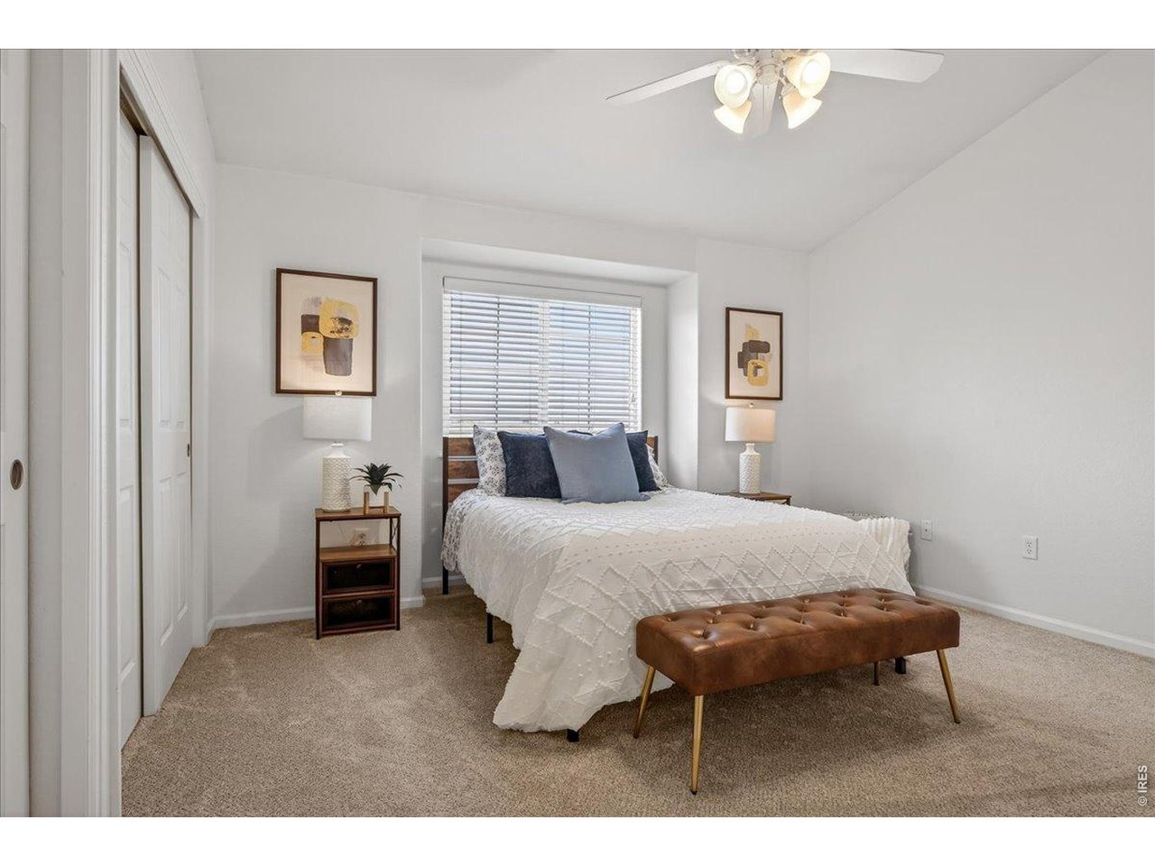 10381 Cook Way, Unit 202 Thornton, CO 80229 - Photo 16 of 38 Natural light fills the spacious primary bedroom.