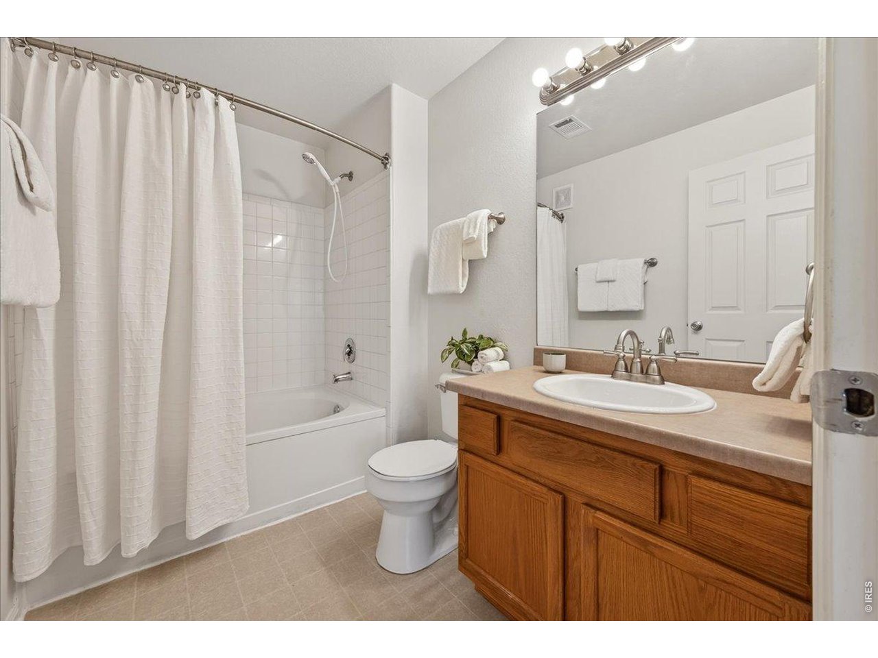 10381 Cook Way, Unit 202 Thornton, CO 80229 - Photo 17 of 38 The primary bedroom flows seamlessly into the full primary bathroom.