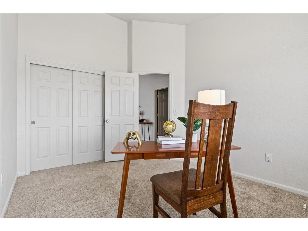 10381 Cook Way, Unit 202 Thornton, CO 80229 - Photo 19 of 38 This secondary bedroom offers flexible space perfect for a guest room, home office, workout area, or creative studio.