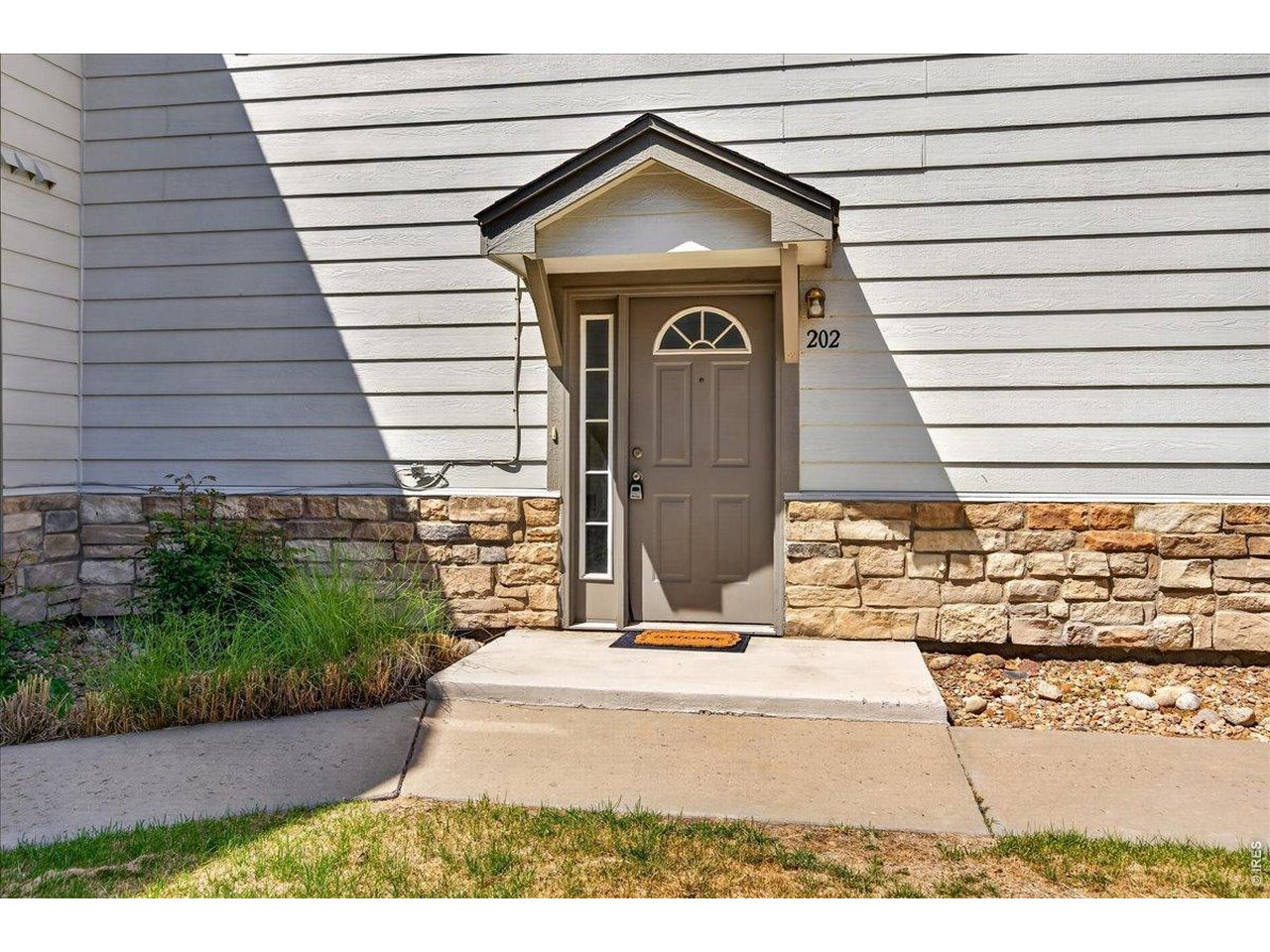 10381 Cook Way, Unit 202 Thornton, CO 80229 - Photo 2 of 38 The inviting entryway offers great curb appeal and a warm first impression for guests and homeowners alike.