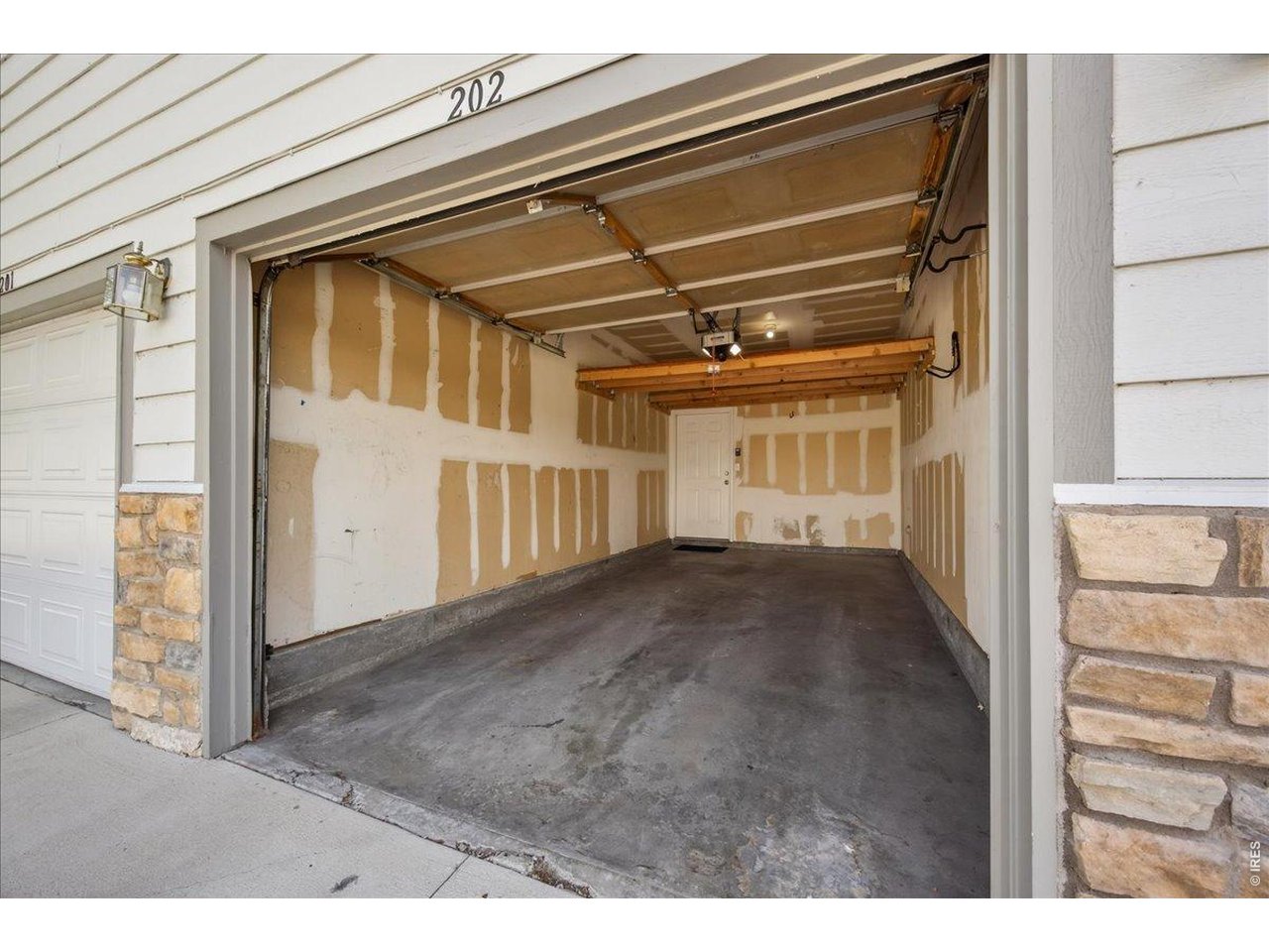 10381 Cook Way, Unit 202 Thornton, CO 80229 - Photo 25 of 38 The attached 1 car garage gives direct access into the home.