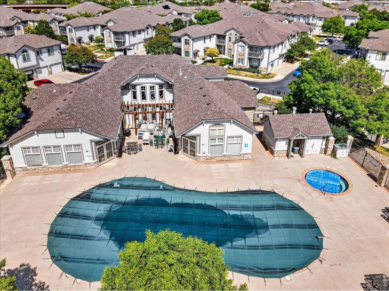 10381 Cook Way, Unit 202 Thornton, CO 80229 - Photo 31 of 38 Enjoy access to the community pool and hot tub area, perfect for relaxing on warm Colorado days or gathering with friends and neighbors.