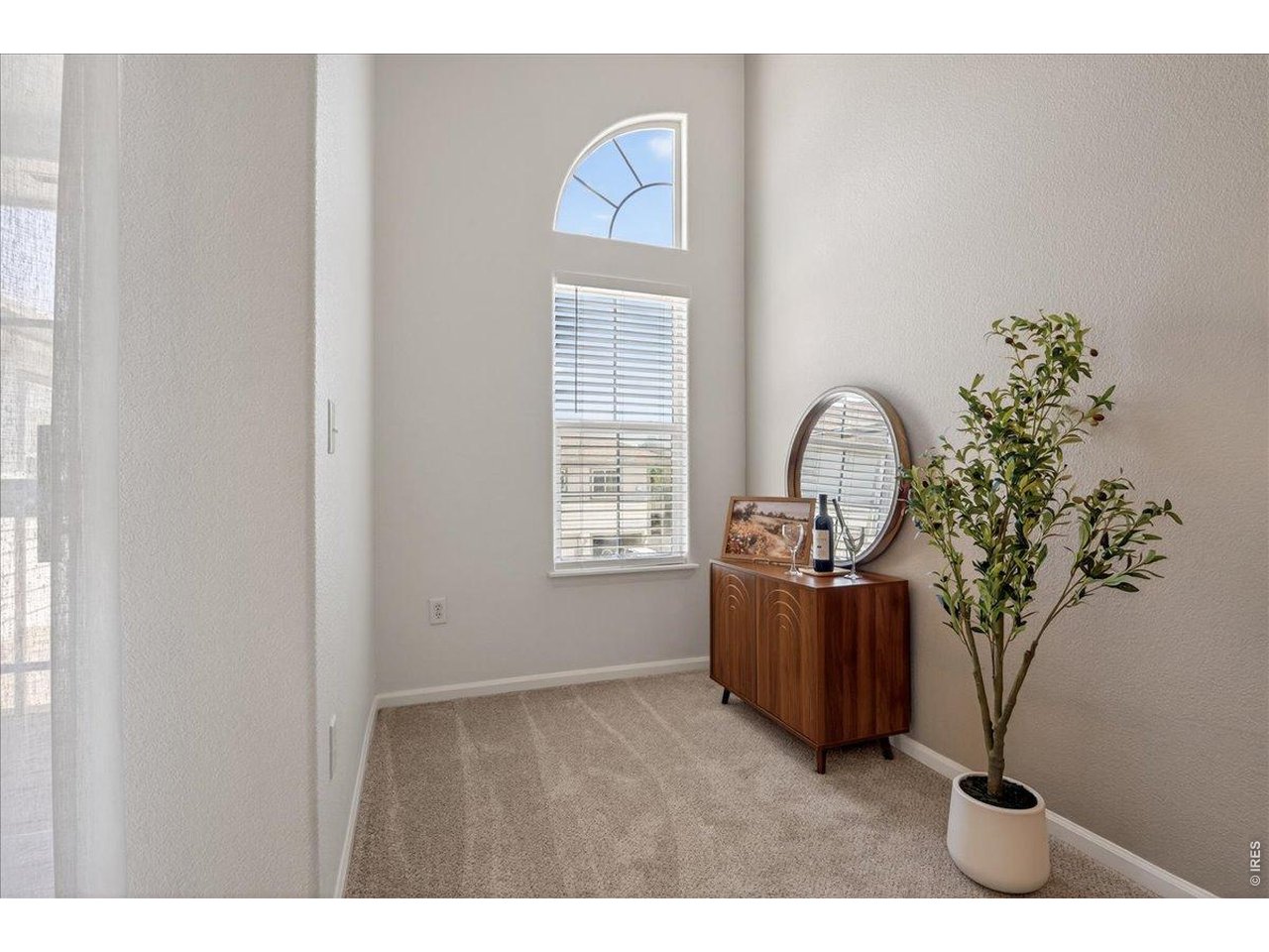 10381 Cook Way, Unit 202 Thornton, CO 80229 - Photo 6 of 38 A versatile alcove area just off the living room provides the perfect space for a home office, reading nook, or additional sitting area.