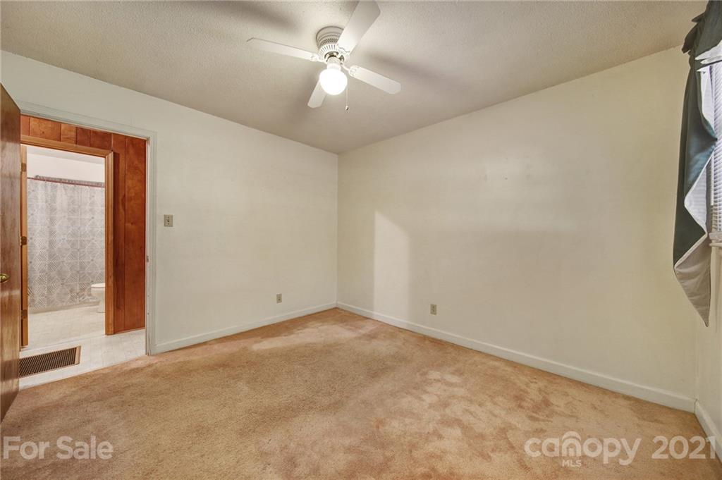 2640 Holbrook Road Fort Mill, SC 29715 - Photo 14 of 24 an empty room with a ceiling fan and a window