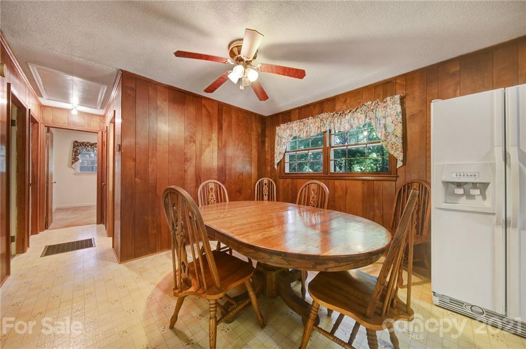 2640 Holbrook Road Fort Mill, SC 29715 - Photo 7 of 24 a dining room with furniture a chandelier and window